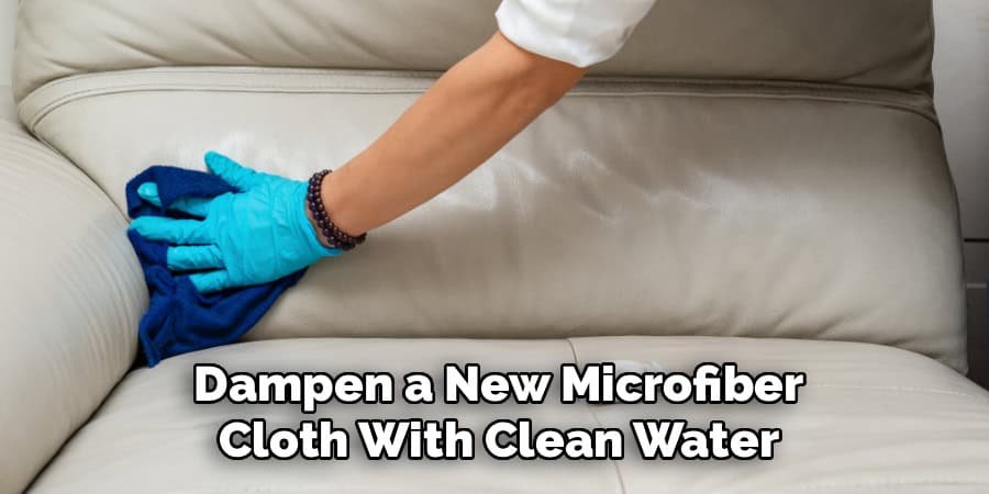 Dampen a New Microfiber
Cloth With Clean Water