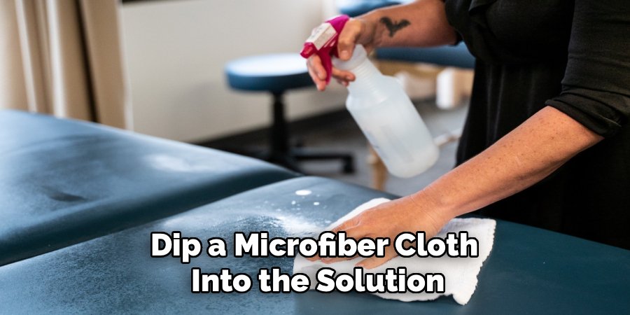 Dip a Microfiber Cloth 
Into the Solution