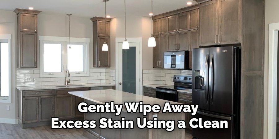 Gently Wipe Away
Excess Stain Using a Clean