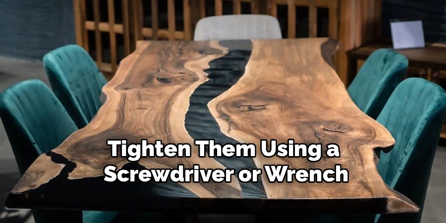 Tighten Them Using a
Screwdriver or Wrench