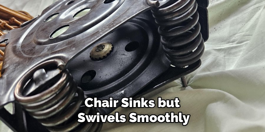 Chair Sinks but 
Swivels Smoothly